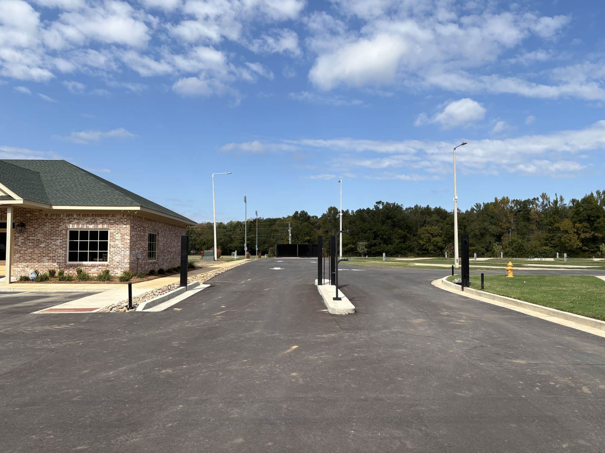 The paved entrance drive past the office into Evergreens RV Park